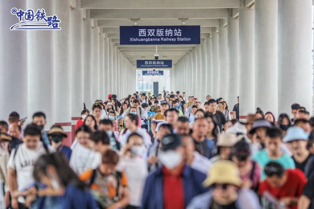 Passengers waiting on a platform at Xishuangbanna railway station