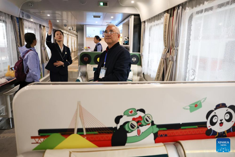Passengers boarding the Panda Train at Guiyang on 8 May 2024