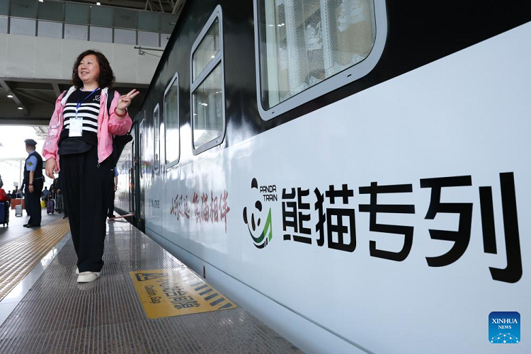Passenger posing beside the Panda Train at Guiyang on 8 May 2024