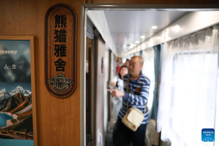 Passengers boarding the Panda Train at Guiyang on 8 May 2024