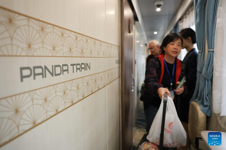 Passengers boarding the Panda Train at Guiyang on 8 May 2024